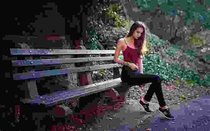 A Black And White Photo Of A Young Woman Sitting On A Bench In A Park. Songs In Sepia And Black White