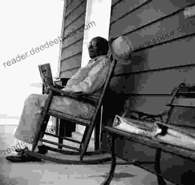 A Black And White Photo Of An Old Man Sitting In A Rocking Chair. Songs In Sepia And Black White