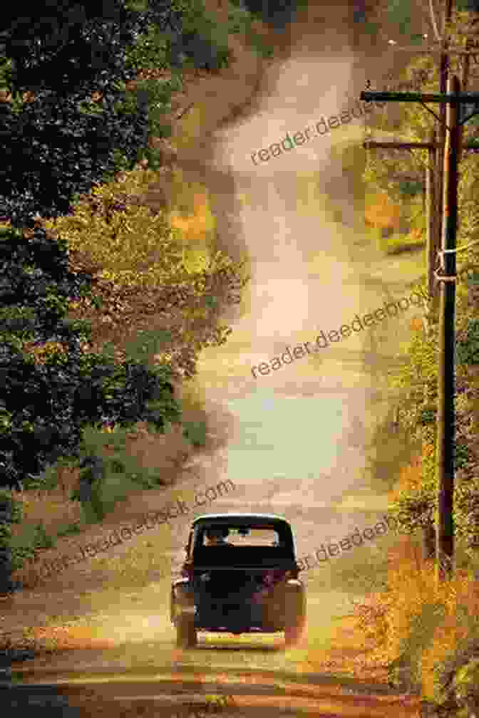 A Historical Image Of A Truck On A Dirt Road. The Road That Trucks Built