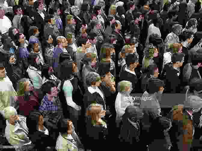 A Man Standing Confidently In A Crowd Of People Who Are All Facing The Same Direction. The Anomaly Mind Set: How I Transformed My Business And My Life By Standing Out Instead Of Fitting In