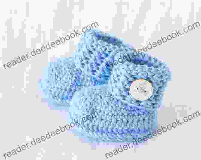 A Pair Of Knitted Baby Booties In A Light Blue Color. Knit A Monster Nursery: Practical And Playful Knitted Baby Patterns