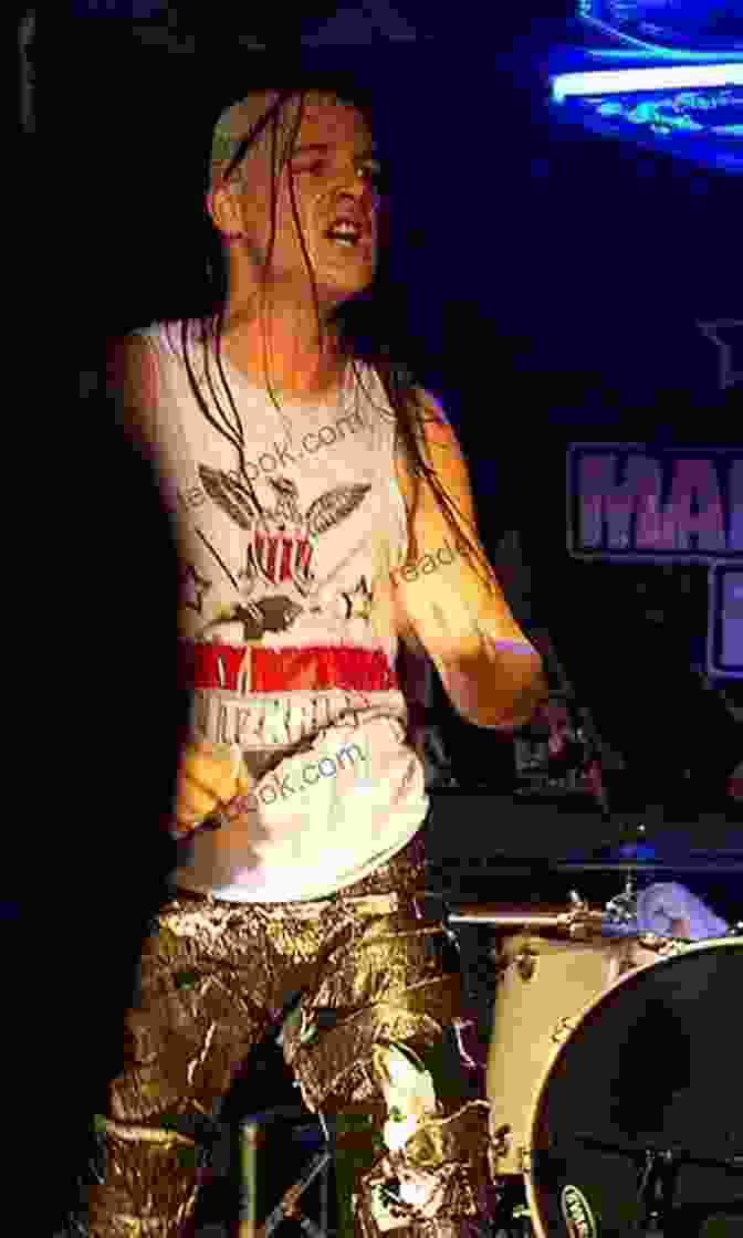 A Photograph Of Michale Graves Performing Live On Stage. He Is Shown Wearing A Black Leather Jacket And Studded Wristbands, With His Microphone In Hand And A Determined Expression On His Face. My Punk Rock Michael Essington