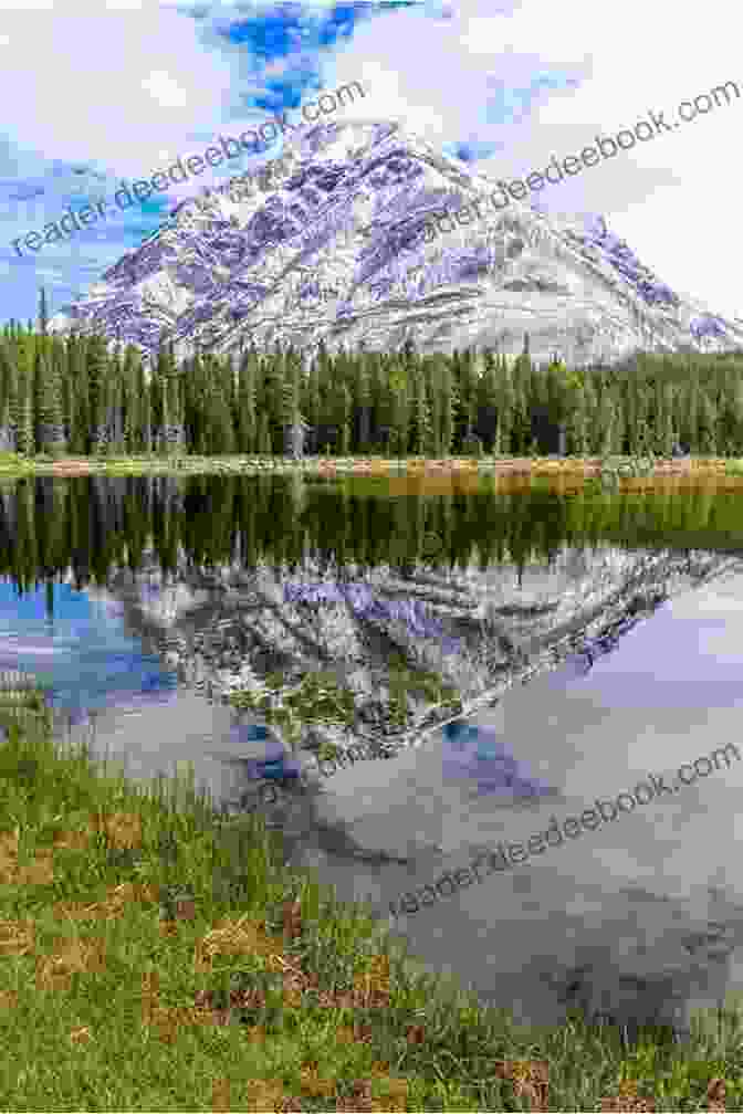 A Stunning View Of The Rocky Mountains, With Towering Peaks, Pristine Lakes, And Lush Forests. Adventures In The Rocky Mountains (Penguin Great Journeys)