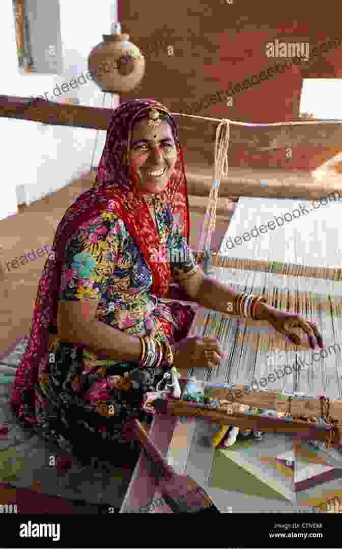 Katey Howes Stands At A Loom In India, Surrounded By Local Weavers. She Is Wearing A Traditional Indian Dress And Learning The Art Of Loom Weaving. Woven Of The World Katey Howes